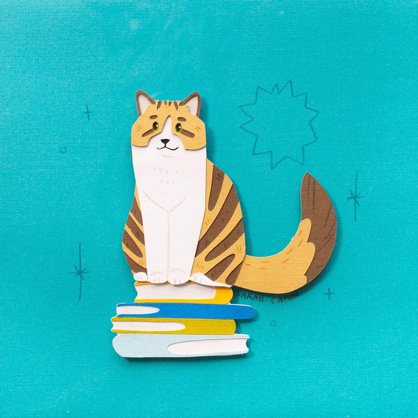 Tabby cats on Books